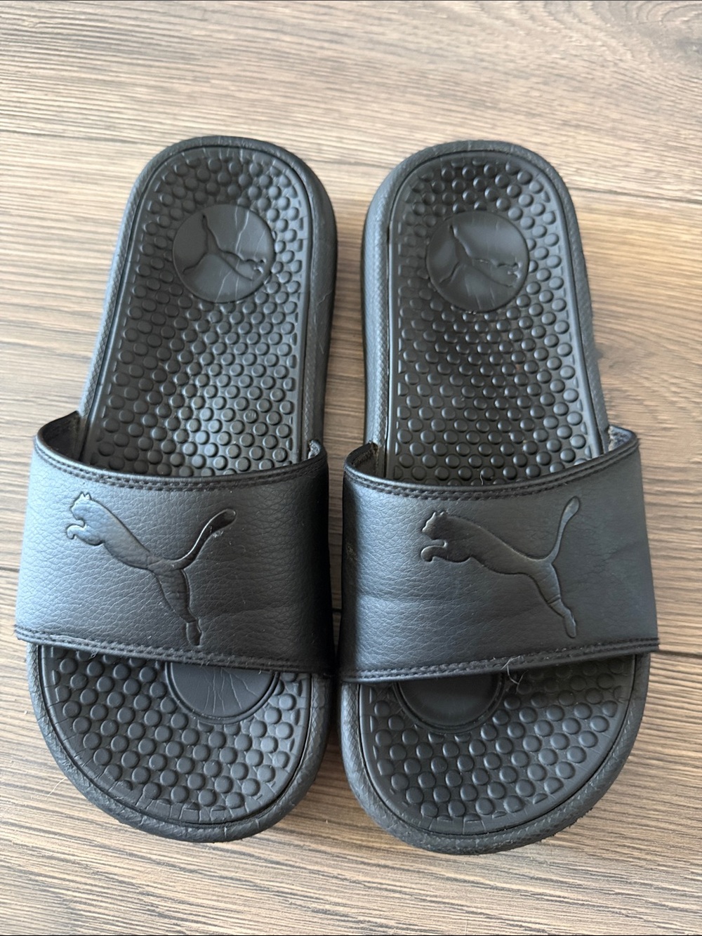 Puma Women's Black Slide Sandals with Embossed Cat Logo